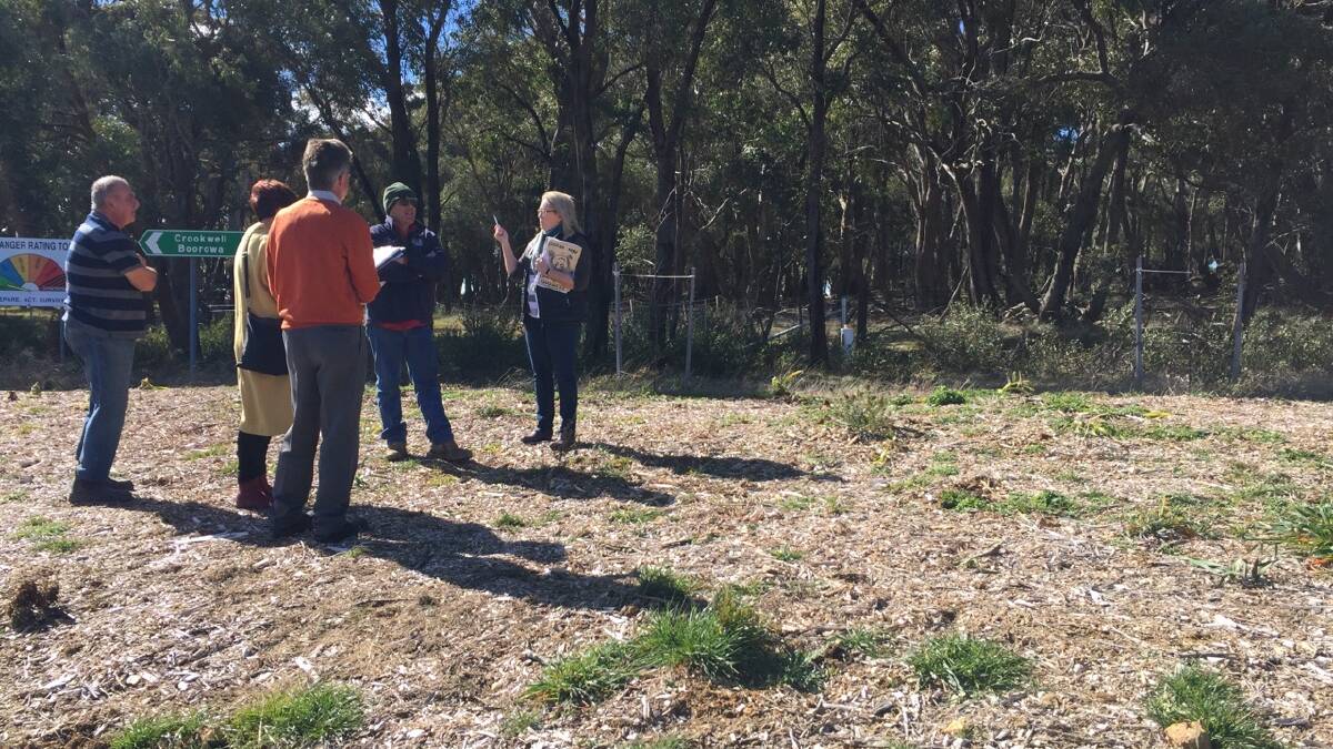 DISCUSSIONS: Some of the members of the Grabben Gullen Progress Association meeting with Jennie and Chris Curtis of Fresh Landscape Designs. Photo Bronwyn  Haynes