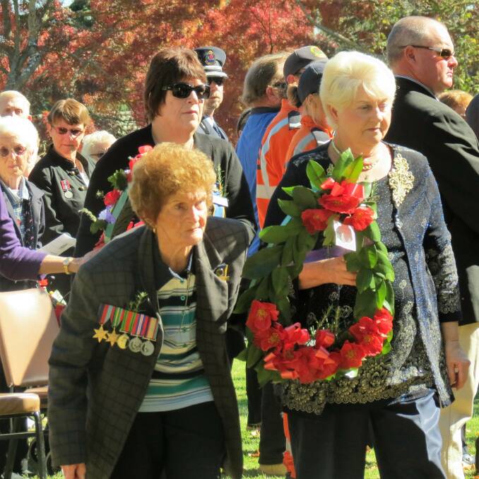 SUPPORTERS: The Crookwell Country Women's Association always supports Anzac Day commemorations by laying a wreath. In 2016, president Margaret Williams along with CWA member Lillian Marshall (pictured) were present. The CWA is partnering with the Criterion Hotel to raise funds this year for 'Soldier On'. Photo: Bronwyn Haynes