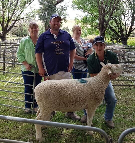 Ram sale: Lyn Madden with top-price ram purchasers Nick, Tanya and Roy Hearn and stud principal and Scott Madden. Photo supplied.