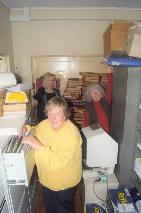 Tight squeeze: Dianne Ball, Jenny Painter and Marion Brace with the vast historical collection at the Crookwell Historical Society.