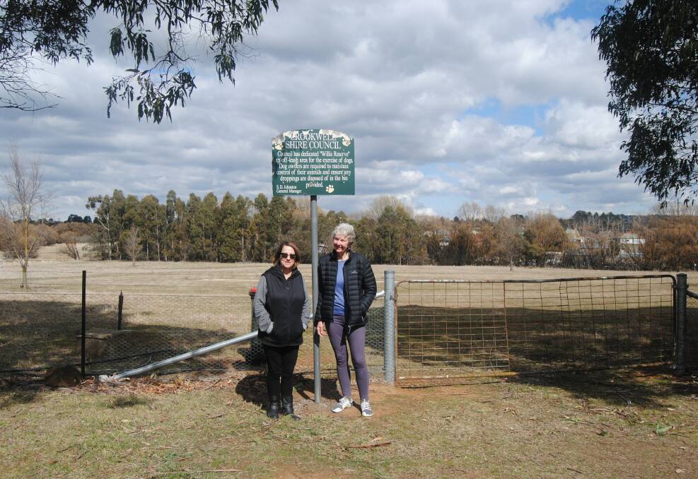 Dog park saved: Campaigners Lea O'Brien and Jenny Readman revealed as the search moves on from Willis Reserve. Photo: Clare McCabe