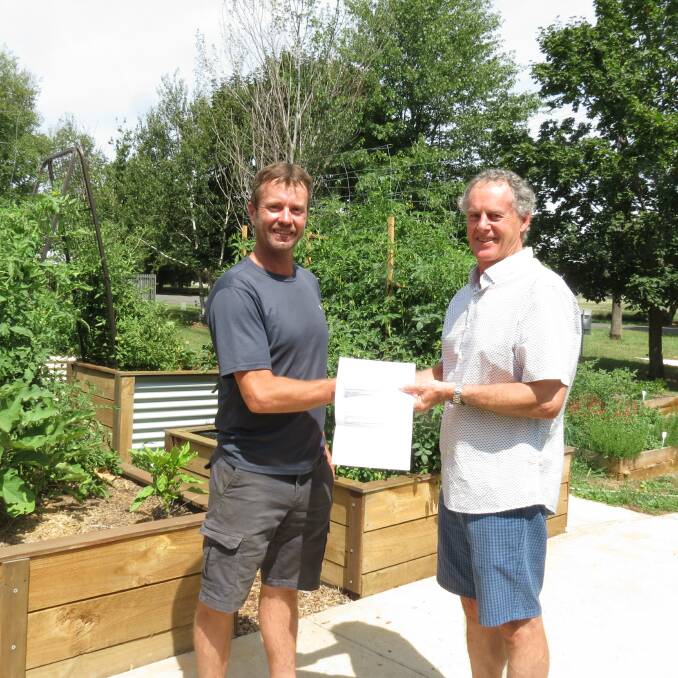 Blooming: Garden commitee member Daniel Hartwell and Charlie Prell from the Upper Lachlan Foundation. Photo supplied. 