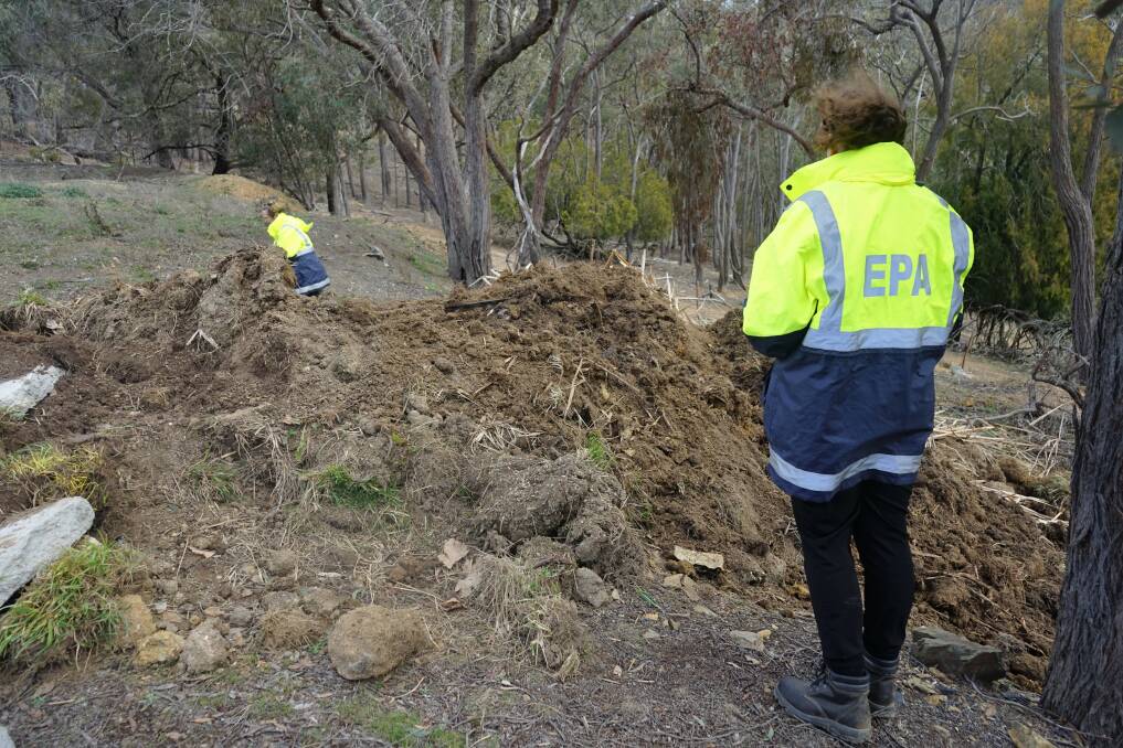 Investigation: EPA officers investigate a site of building waste for environmental controls. Photo: Clare McCabe
