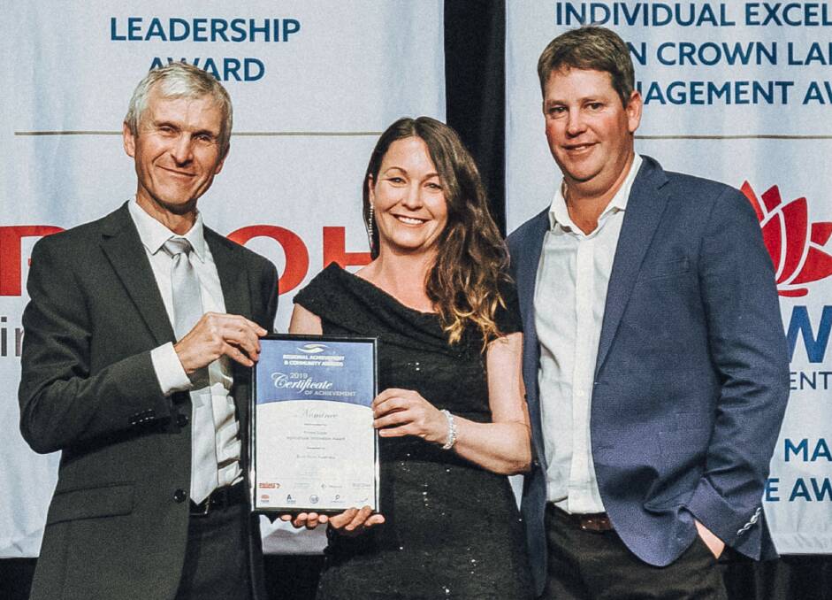 On-farm innovation: Richard Bush, NSW Crowns Land Commissioner with Theresa and Craig Robinson from Bumnuts, Gunning. Photo supplied.