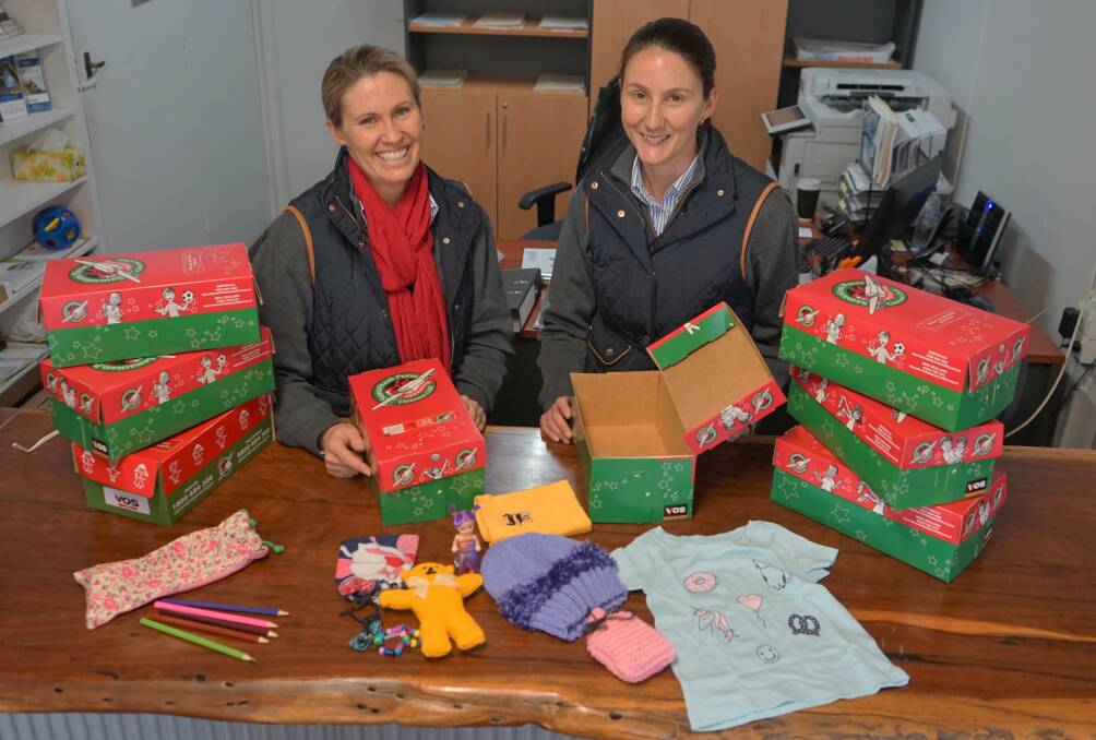 Christmas Spirit: Boxes are available from Robyn Duncombe and Allison Hewitt at Duncombe and Co in Crookwell for the Operation Christmas Child appeal. Photo: Clare McCabe.