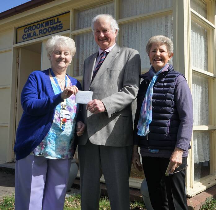 President of the CWA Lillian Marshall presents a cheque to the Crookwell Community Trust's John Mendl, pictured with Elaine Delaney. Photo: Clare McCabe