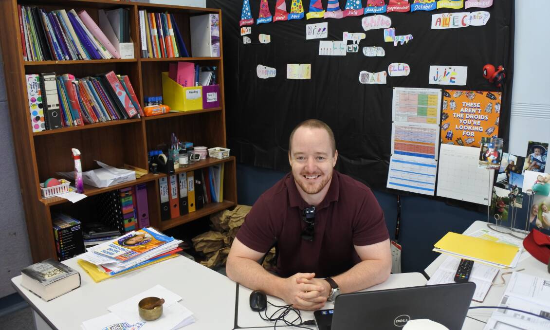 New recruit: Teacher Dave Collinge preps for his Year 5 class at St Mary's. 