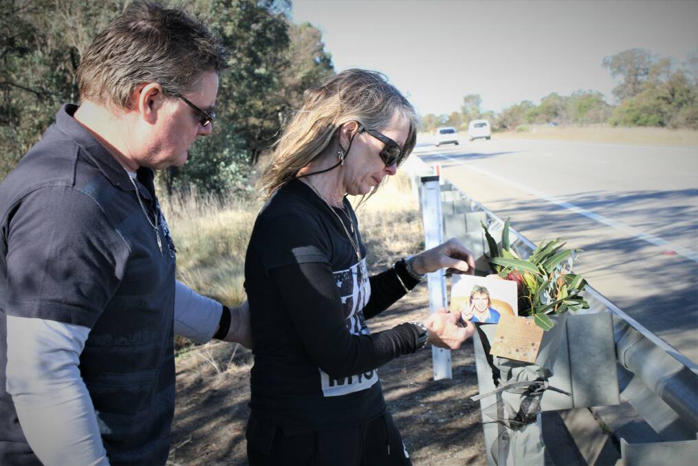 Desmond Stephen May's brother in law Andrew Watson and sister Cheryl Drennan-Watson lay flowers near Gunning, where he was killed in a truck crash. Picture: Hannah Sparks