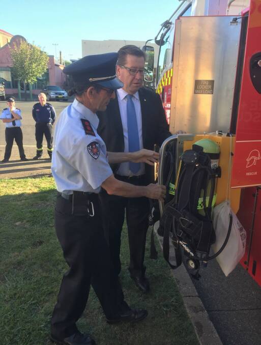 Captain Glenn Bonomini showing off the design of the new tanker to Minister for Police and the Minister for Emergency Services Troy Grant.
