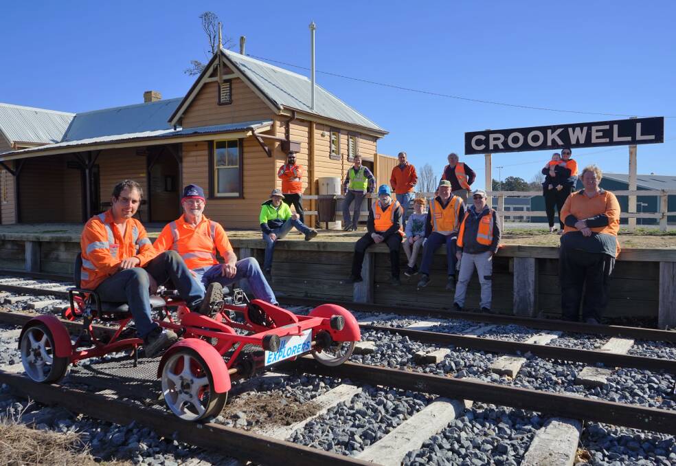 Full-steam ahead: Crookwell Heritage Railway's Lenny Stewart and Peter Simpson testing the pedal-powered railway bike. Photo: Clare McCabe