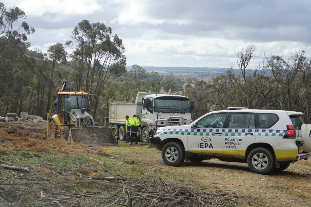 Investigation: EPA officers investigate a site of building waste for environmental controls. Photo: Clare McCabe