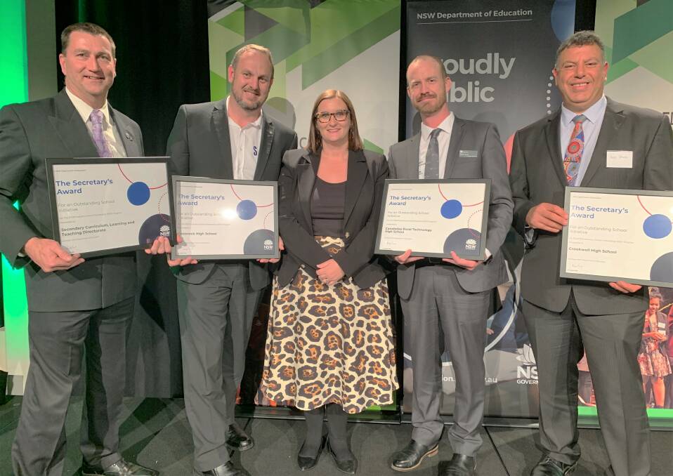 Education: Mr Vero Joseph (right) accepts the award from the NSW Minister for Education and Early Childhood Learning Sarah Mitchell (centre) with representatives from secondary curriculum, Cessnock and Canobolas High Schools.