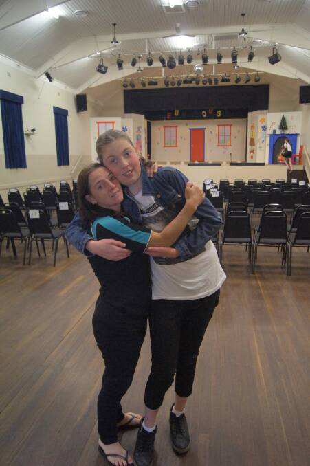 Children arrive for the third show, (L-R) co-director Rechelle Naughton and Bryony McCormack.