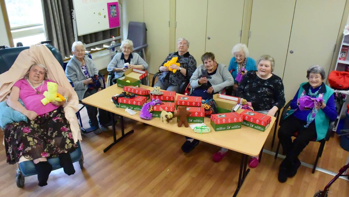 Handcrafted with love: Viewhaven residents show off their wares (L-R) Estelle Hart, Alice Lamb, Nita Selmes, Dawn O'Connor, Margarette Rose, Shirley Howard, Janet Picker and Daisy Arnall.