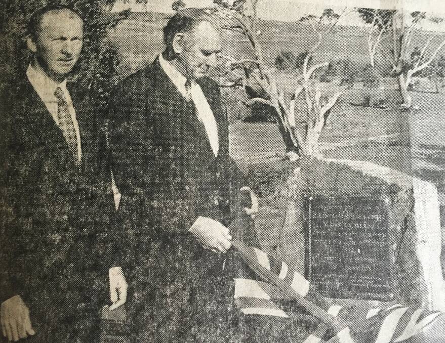 The deputy premier Sir Charles Cutler unveils the commemorative plaque at the official opening of Narrawa Bridge in 1973 with him is Crookwell Shire president councillor Max Picker. Photo: Crookwell Gazette