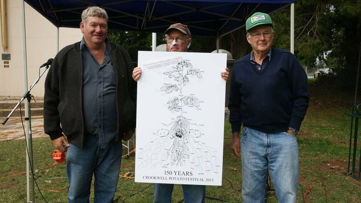 2013: Garry Kadwell and David Montgomery present a plaque to Peter Banfield on behalf of the generations of farmers who have been growing potatoes in the district for 150 years. Photo: Paul Anderson