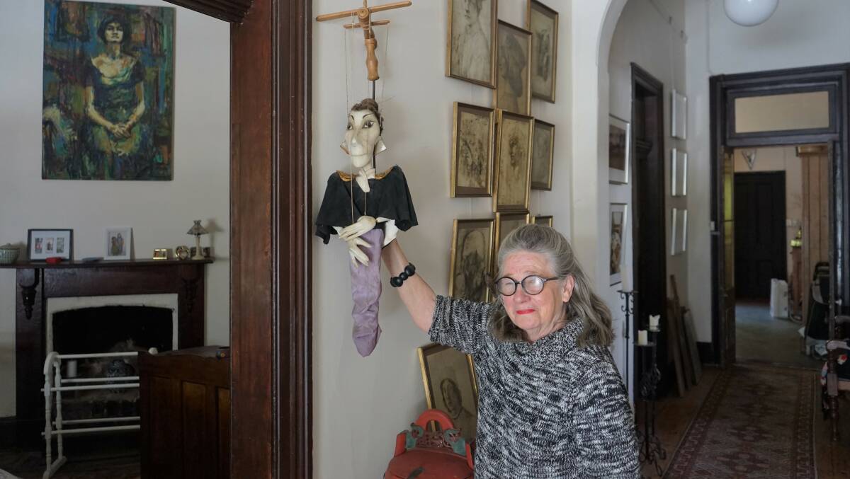 Property: Pam Charity pictured with Tatiana, a collectable puppet, has put the historic Rose Cottage on the market. Photo: Clare McCabe