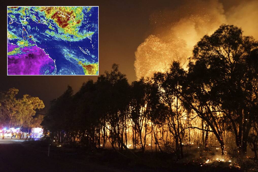 Fire crews confronted by massive flames at Deepwater in central Queensland. The weather bureau is also watching a potential tropical cyclone off the Solomon Islands. Photo supplied: Rob Griffith at Costi Farms/AP