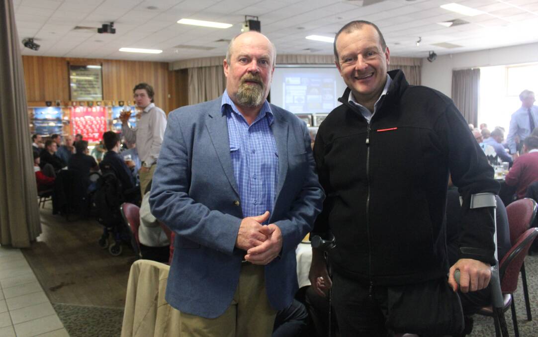 Inspiration: Co-organiser of the Crookwell Pup's sportsmen's lunch John Mccue with guest speaker, Paralympian Michael Milton. Photo: Burney Wong