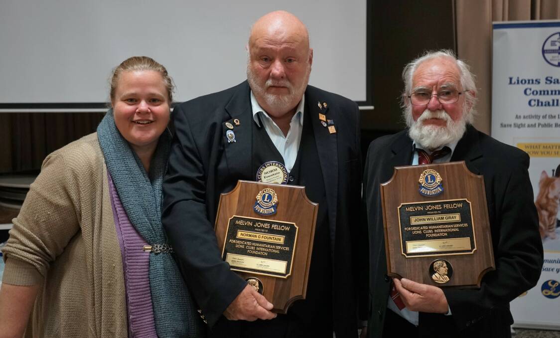 Recognition for Lions: Outgoing president Jennifer Hall with Norm Fountain and John Gray honoured with the Lions highest distinction. Photo: Clare McCabe.