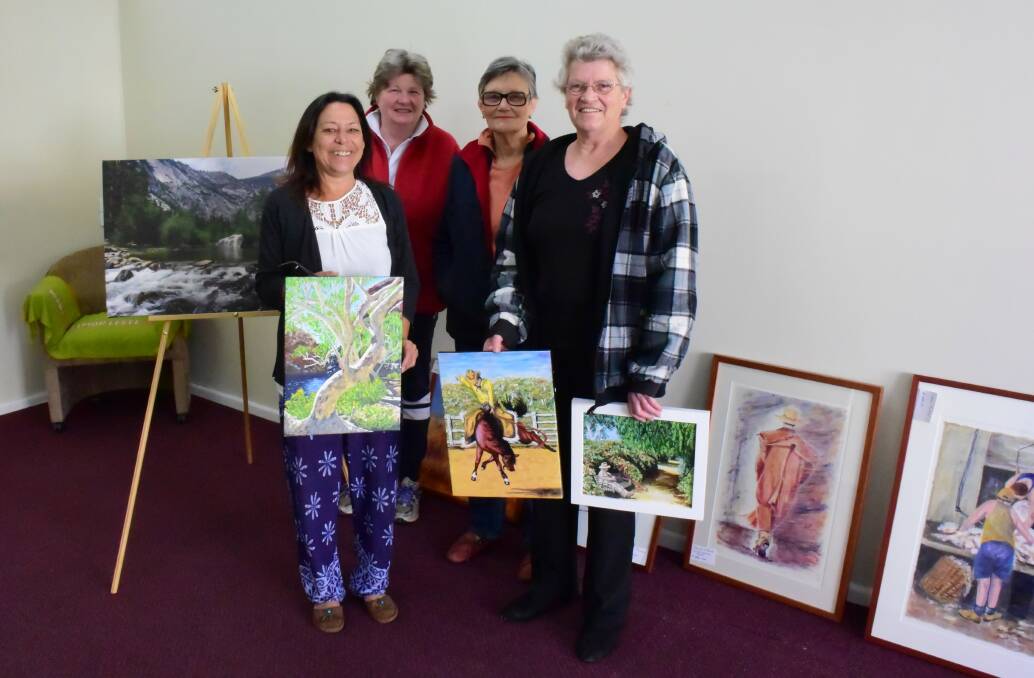 Excitement builds at collab art space: (L-R) Sharyn Throsby, Margaret Carr, Karen Harwood and Margaret Wonson receive deliveries of local artwork. Photo: Clare McCabe