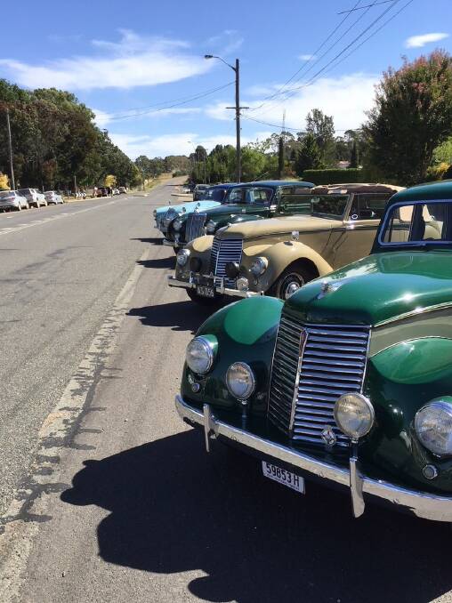Gorgeous vintage cars line up on the main street