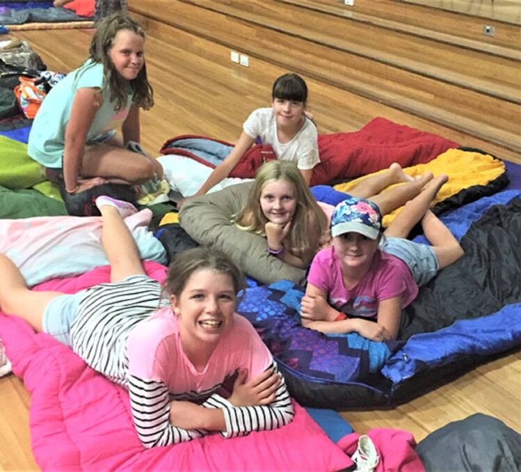 COMFORTABLE: Jess Langford, Kayla Merryfull, Mikayla Smith, Tilly Plumb and Courtney Merryfull settle in at the Peer Support ‘Sleepover’.