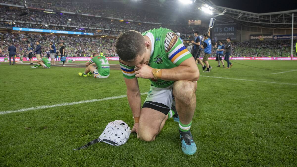 Shattered: Jarrod Croker fell to his knees after Canberra's narrow loss to the Roosters in Sunday night's grand final. Photo: Sitthixay Ditthavong. 