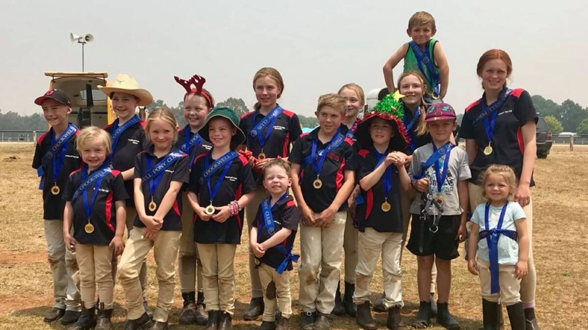 Winners: The Pony Club's award recipients can't restrain their glee during the anniversary celebrations on Sunday. Photo: Crookwell Pony Club. 