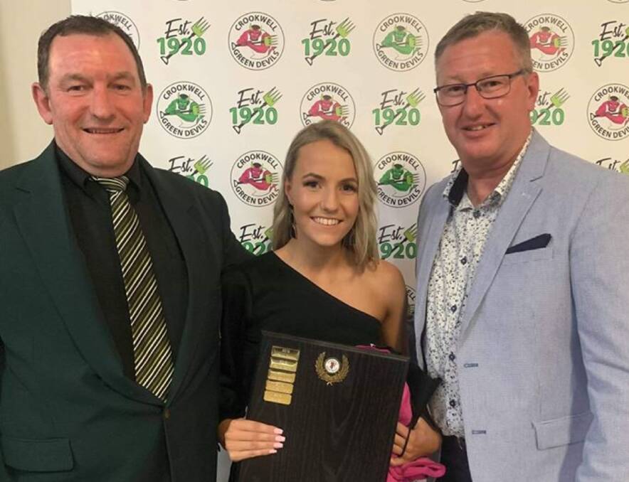 New president: Paddy Lenane (right) will take over the club presidency and continue coaching with Chris Chudleigh (left). The pair are seen here presenting the She Devils' Best and Fairest award to Grace Smith in September. Photo: Crookwell Green Devils.