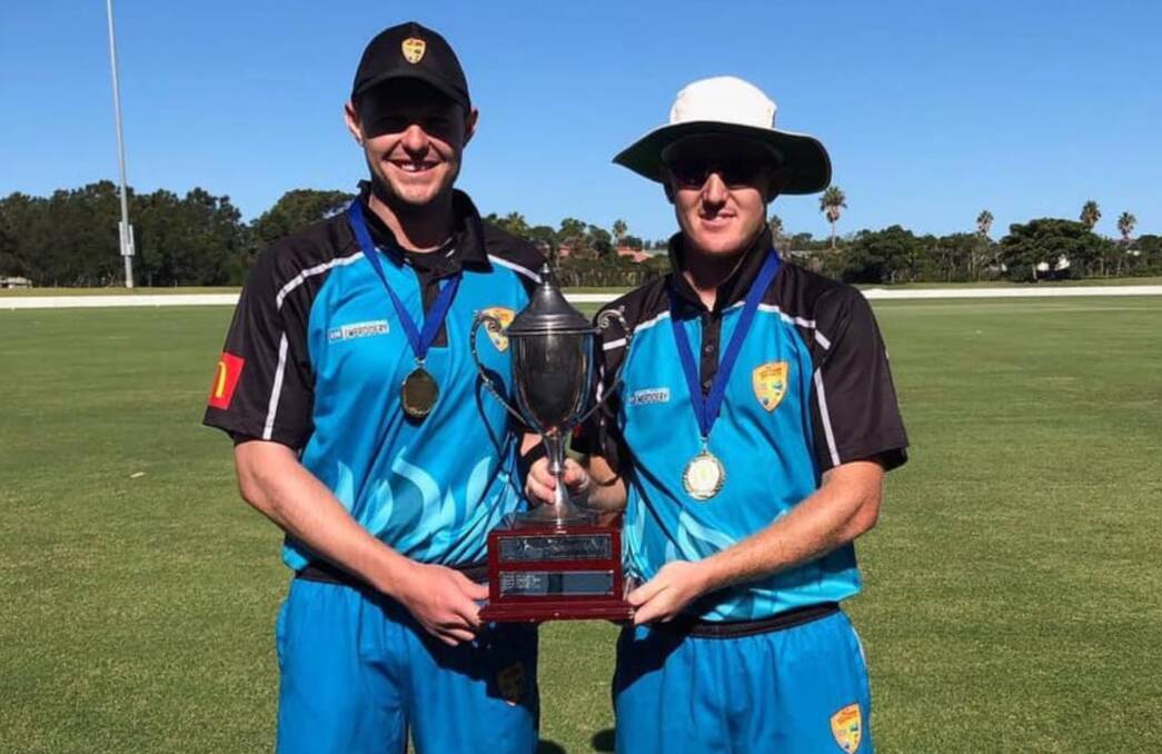 Winners: GDCA's Brad Smith (left) and Josh Watling are all smiles as they hoist the Country Championships trophy after their grand final win over Central Coast. Photo: Supplied.