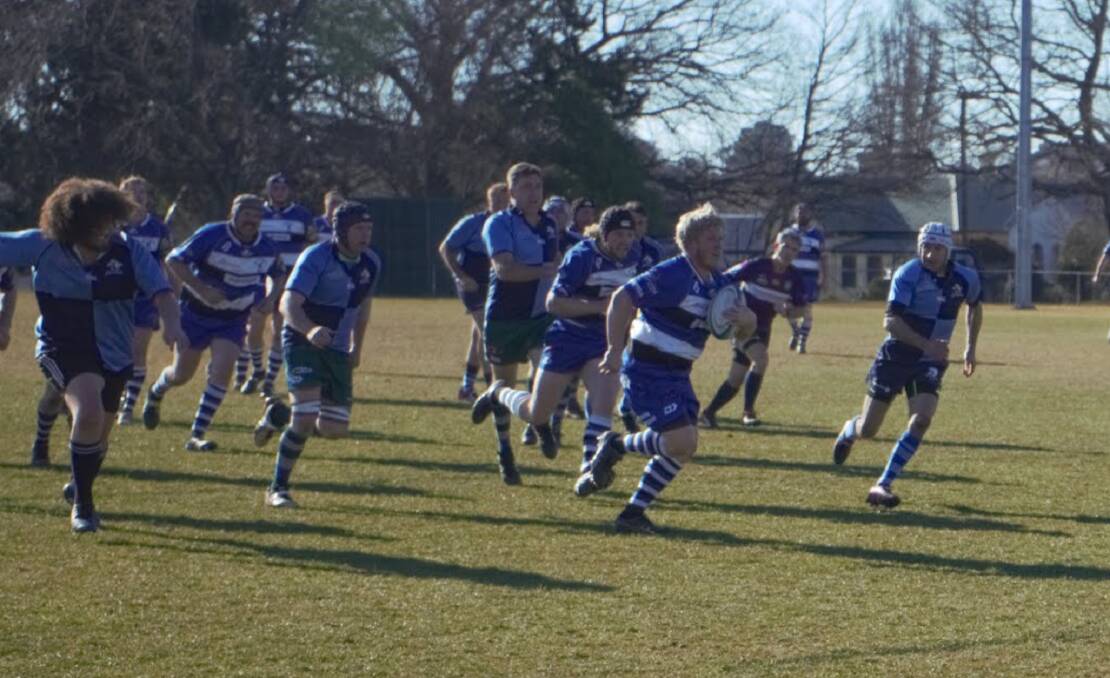 On the run: Crookwell head for the tryline as Broulee try in vain to keep pace on Saturday. Photo: Clare McCabe. 