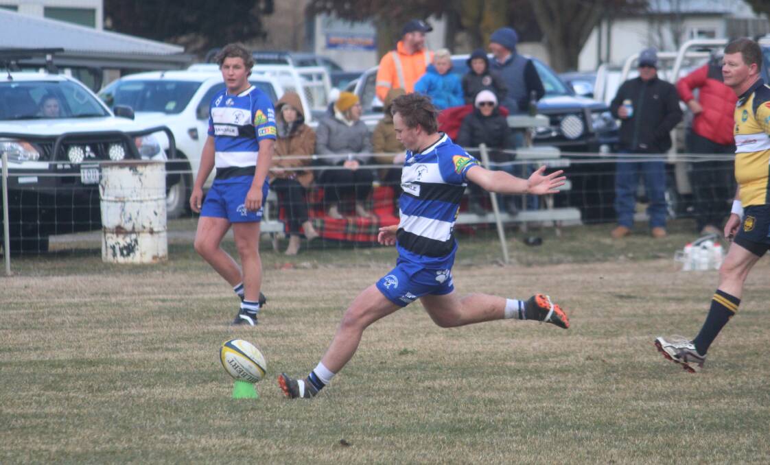 Launched: Liam Jones about to kick one of his three penalty goals for Crookwell on Saturday against the Taralga Tigers, in a match the Dogs won to book a spot in the 2019 grand final. Photo: Zac Lowe.