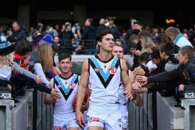 Port Adelaide captain Connor Rozee (c) is a certain starter against Adelaide. (James Ross/AAP PHOTOS)
