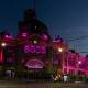 Melbourne first to light up famous landmarks in pink in memory of cancer fighter Olivia Newton-John. (Diego Fedele/AAP PHOTOS)