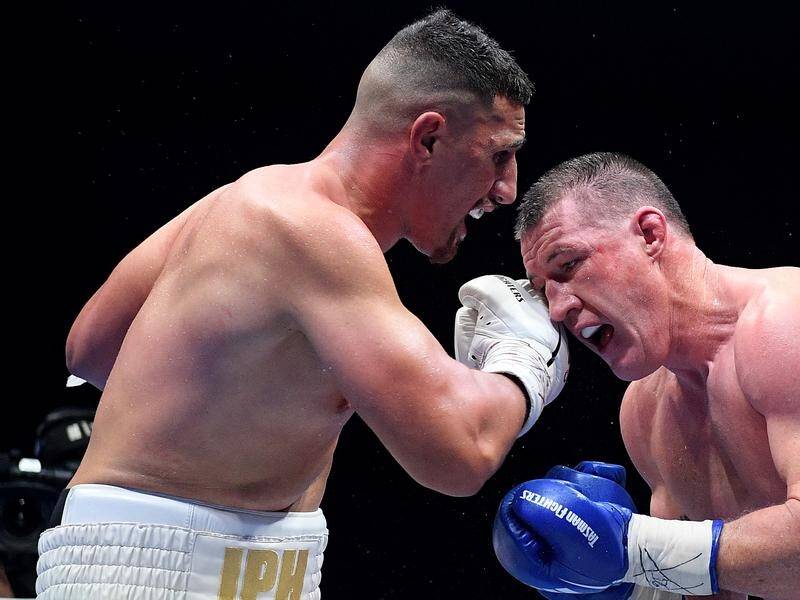 Justis Huni (l) has ended the unbeaten boxing career of Paul Gallen with a TKO in the 10th round.