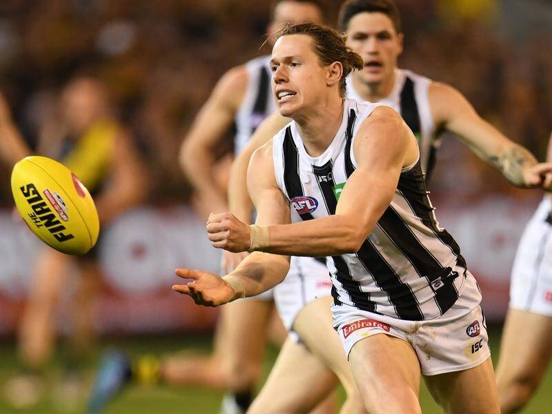 Collingwood defender Tom Langdon has re-committed to the Magpies for another three years.