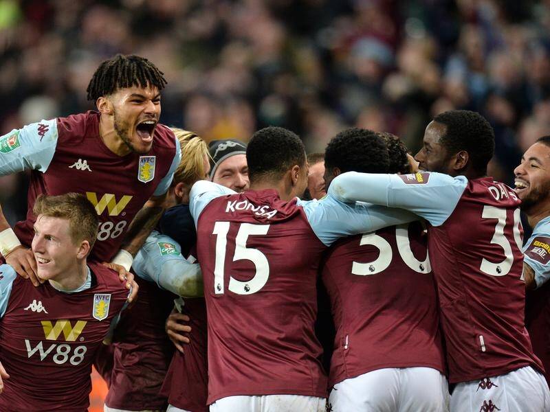 Tyrone Mings (top) and his Villa teammates celebrate their semi-final League Cup win over Leicester.