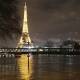 Paris has been lashed by rain as storms belt Britain and France. (AP PHOTO)