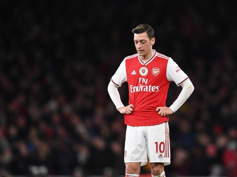 Mesut Ozil's agent has joined in the row over the Arsenal man's exclusion from their EPL squad.
