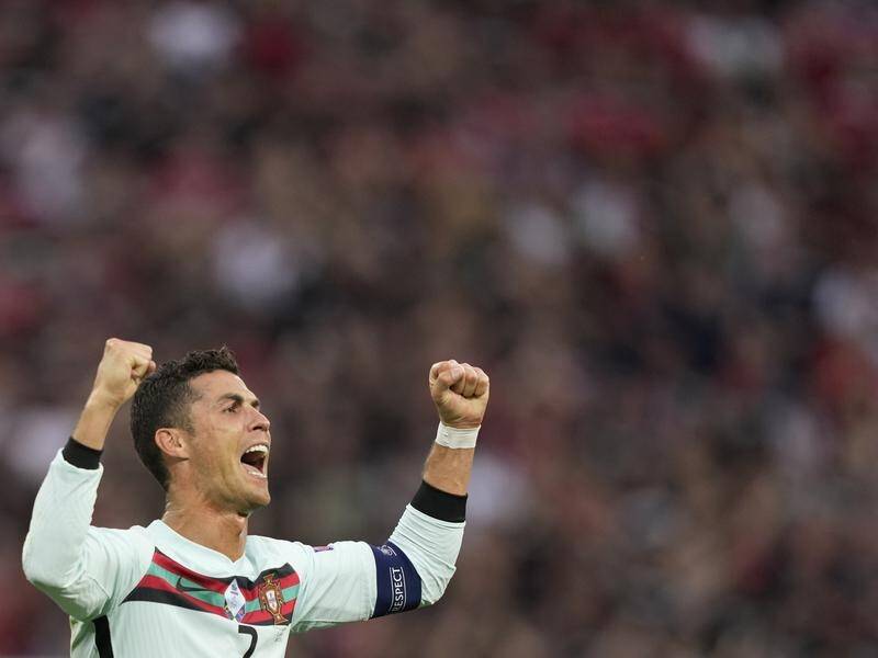 Cristiano Ronaldo celebrates after scoring in the soccer match between Hungary and Portugal.