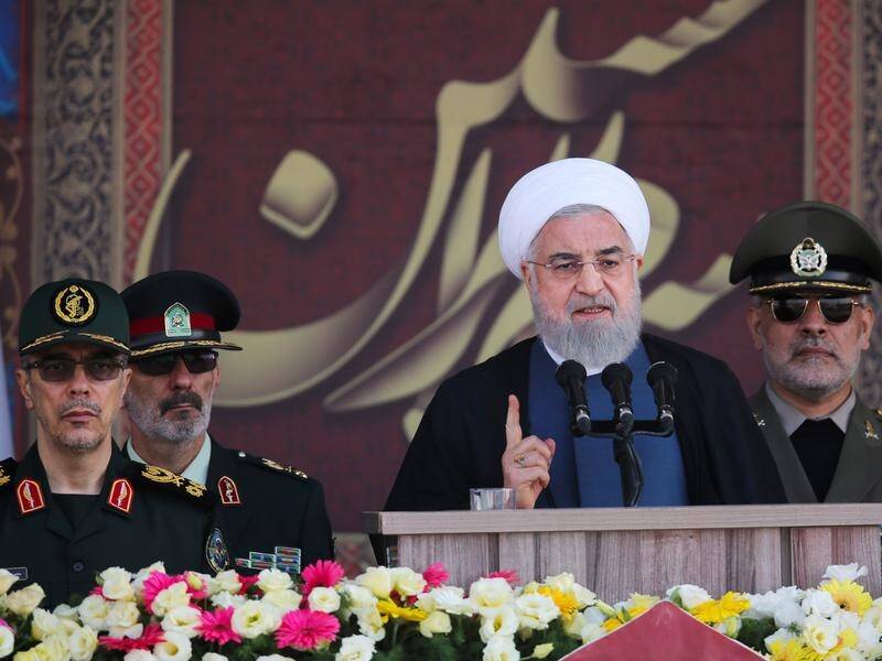 Iran's President Hassan Rouhani (C) says the West should leave the Persian Gulf to regional nations.