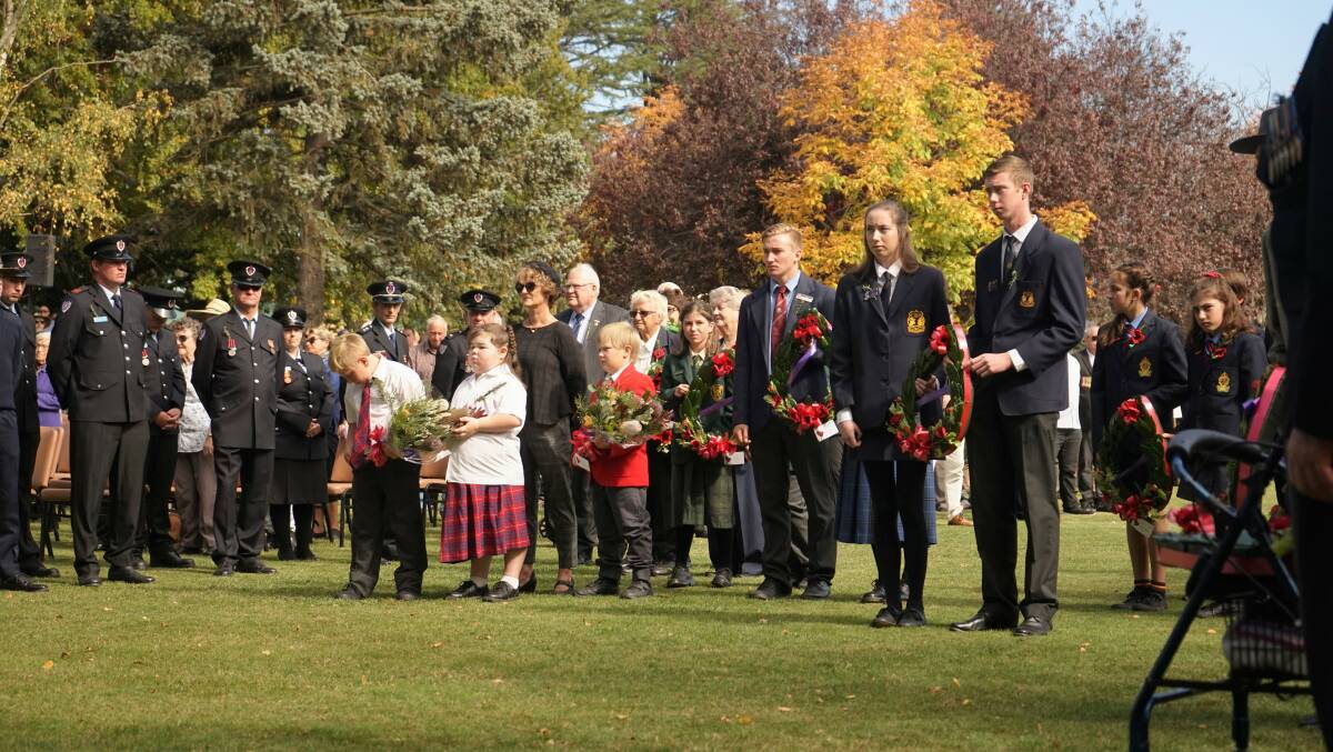 UNTIL NEXT YEAR: School children lay wreaths at the 2019 Crookwell Anzac Day commemorative service. Photo: Clare McCabe