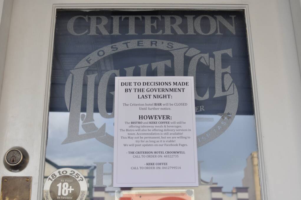 A sign on the door at The Criterion Hotel letting customers know the bar is closed due to coronavirus. Photo: Hannah Sparks