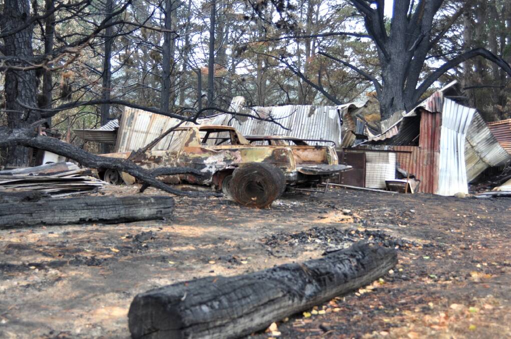 The shed at Kevin Flemming's Wombeyan home is destroyed in the Green Wattle Creek fire. Photo: Hannah Sparks
