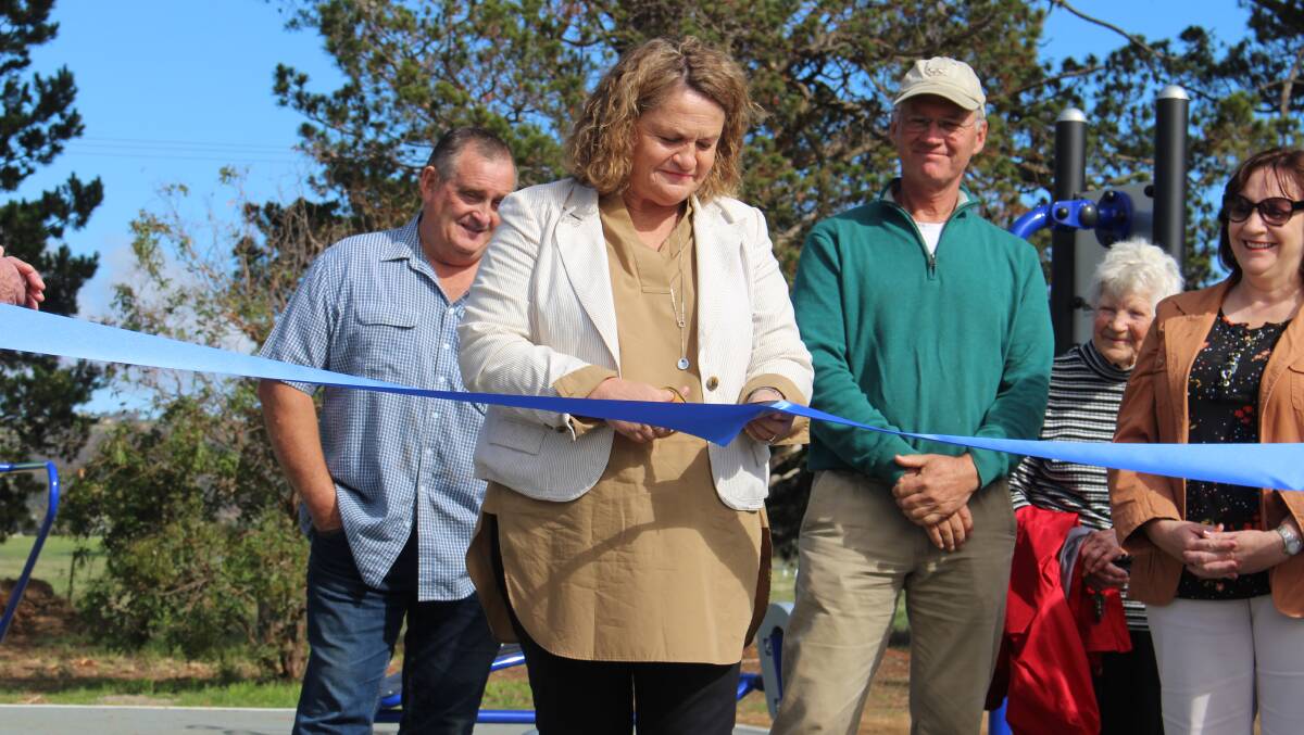 HIP HIP HOORAY: State member for Goulburn Wendy Tuckerman cuts the ribbon to officially open Collector's new outdoor gym and footpaths. Photo: Chris Gordon