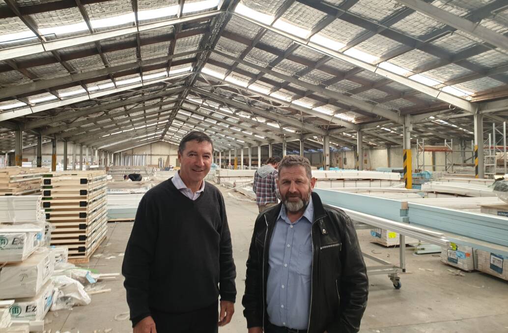 Update: RDASI Chair Hugh Cooke with Mike Agnew. A proposal was earlier made to redevelop a former Goulburn wool warehouse to house the wool selling centre. Photo: Supplied.