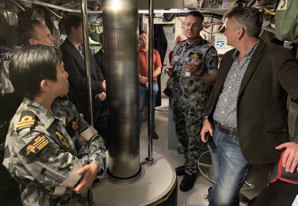 Submariner Lieutenant Josephine Rider and Executive Officer Timothy Markusson giving a tour on board the HMAS Dechaineux. Photo: NADINE MORTON 111618nmsub20