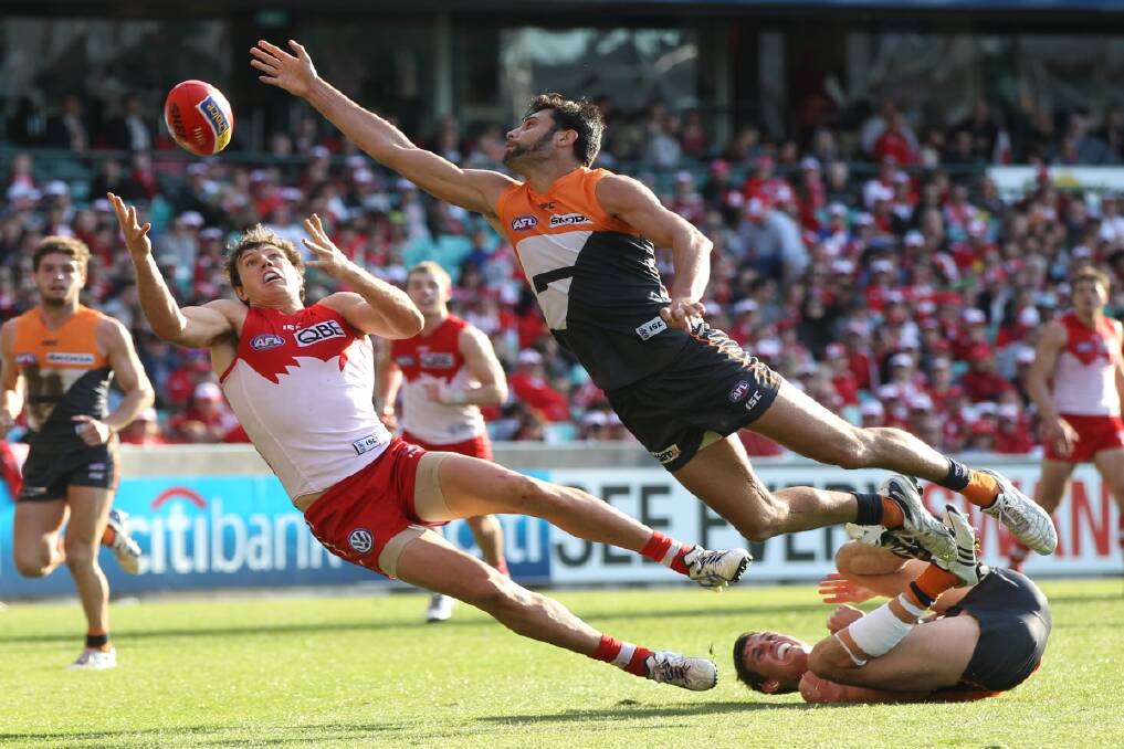 Kurt Tippett attempts to outmark Setanta O'hAilpin during the AFL game between the Sydney Swans and GWS Giants at the SCG in Sydney. Photo: Anthony Johnson   